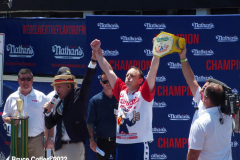 July 4  2022  NEW YORK  
Nathan's Famous Fourth of July International Hot Dog Eating Contest held at the corner of Surf ave. and Stillwell ave. where the original Nathan's Hot Dog stand opened over a hundred years ago.  Joey Chestnut win for the 15 year. eating 63 hot Dogs and Buns.