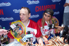 July 4  2022  NEW YORK  
Nathan's Famous Fourth of July International Hot Dog Eating Contest held at the corner of Surf ave. and Stillwell ave. where the original Nathan's Hot Dog stand opened over a hundred years ago.  Joey Chestnut win for the 15 year. eating 63 hot Dogs and Buns.