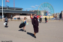 Coney Island Brooklyn. The Coney Island Polar Bear Club jumped into the Atlantic Ocean for their weekly swim. The air temperature was 37 degrees while the water temperature was 43 degrees, Onlookers were bundled up from the wind and cold.