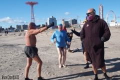 Coney Island Brooklyn. The Coney Island Polar Bear Club jumped into the Atlantic Ocean for their weekly swim. The air temperature was 37 degrees while the water temperature was 43 degrees, Onlookers were bundled up from the wind and cold.