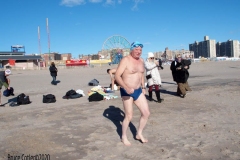 Coney Island Brooklyn. The Coney Island Polar Bear Club jumped into the Atlantic Ocean for their weekly swim. The air temperature was 37 degrees while the water temperature was 43 degrees, Onlookers were bundled up from the wind and cold.