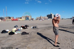 Coney Island Brooklyn. The Coney Island Polar Bear Club jumped into the Atlantic Ocean for their weekly swim. The air temperature was 37 degrees while the water temperature was 43 degrees, Onlookers were bundled up from the wind and cold.