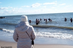 Coney Island Brooklyn. The Coney Island Polar Bear Club jumped into the Atlantic Ocean for their weekly swim. The air temperature was 37 degrees while the water temperature was 43 degrees, Onlookers were bundled up from the wind and cold.