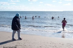 Coney Island Brooklyn. The Coney Island Polar Bear Club jumped into the Atlantic Ocean for their weekly swim. The air temperature was 37 degrees while the water temperature was 43 degrees, Onlookers were bundled up from the wind and cold.