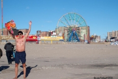 Coney Island Brooklyn. The Coney Island Polar Bear Club jumped into the Atlantic Ocean for their weekly swim. The air temperature was 37 degrees while the water temperature was 43 degrees, Onlookers were bundled up from the wind and cold.