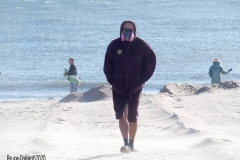 Coney Island Brooklyn. The Coney Island Polar Bear Club jumped into the Atlantic Ocean for their weekly swim. The air temperature was 37 degrees while the water temperature was 43 degrees, Onlookers were bundled up from the wind and cold.