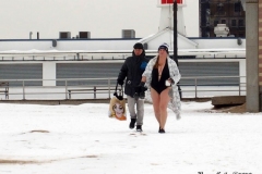 December 20,2020    Coney Island Polar Bears go for their weekly swim. Snow covers the sand because of the snow storm that happened a few days before the swim. The outdoor temperature was 37 degrees and the water temperature is 52 degrees.