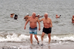 December 20,2020    Coney Island Polar Bears go for their weekly swim. Snow covers the sand because of the snow storm that happened a few days before the swim. The outdoor temperature was 37 degrees and the water temperature is 52 degrees.