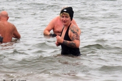 December 20,2020    Coney Island Polar Bears go for their weekly swim. Snow covers the sand because of the snow storm that happened a few days before the swim. The outdoor temperature was 37 degrees and the water temperature is 52 degrees.