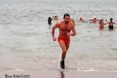 December 20,2020    Coney Island Polar Bears go for their weekly swim. Snow covers the sand because of the snow storm that happened a few days before the swim. The outdoor temperature was 37 degrees and the water temperature is 52 degrees.