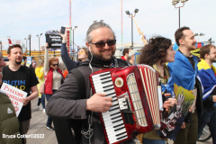 March 19, 2022  New York,  Coney Island
 Hands off Ukraine! /???? ????? ?? ???????!
 LGBTIQ  Russian - Speaking Americans group sponsored a march against Russia on the Coney Island Boardwalk." we are going to march in solidarity with Ukraine. We are going to show our position on the matter as a Ukrainian and Russian-speaking diaspora in New York. Today we are all Ukrainians. Glory to Ukraine!"