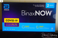 Workers distribute free Binax #COVID19 testing kits on West 125th Street in Harlem, New York City on 24 Dec 2021. The line was over 2 Avenues long