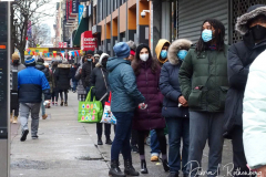 People waiting in line to receive the free Binax #COVID19 testing kits on West 125th Street in Harlem, New York City on 24 Dec 2021. The line was over 2 Avenues long.