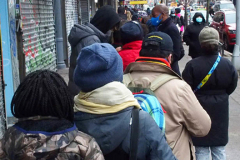 People waiting in line to receive the free Binax #COVID19 testing kits on West 125th Street in Harlem, New York City on 24 Dec 2021. The line was over 2 Avenues long.