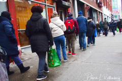 People waiting in line to receive the free Binax #COVID19 testing kits on West 125th Street in Harlem, New York City on 24 Dec 2021. The line was over 2 Avenues long.
