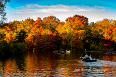 Late afternoon sun in Central Park 11/10/21.  The fine weather brought out simple pleasures.  Boaters enjoy the colors of Central Park.