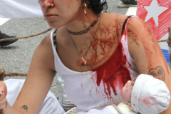 Cuban Americans Rally in front of the United Nations building in New York City. Protestors cover themselves in blood to protest the Human rights violations on the cuban people.