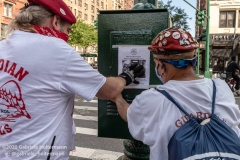 Members of the Guardian Angels put up fliers on the Upper West Side addressing the hotels turned homeless shelters in New York City on August 9, 2020. Residents have complained about an uptick in crime and drugs as well as the housing of sexual offenders in the neighborhood. (Photo by Gabriele Holtermann)