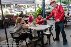 Curtis Sliwa, founder of the Guardian Angels, greets to women on the Upper West Side addressing the hotels turned homeless shelters in New York City on August 9, 2020. Residents have complained about an uptick in crime and drugs as well as the housing of sexual offenders in the neighborhood.(Photo by Gabriele Holtermann)