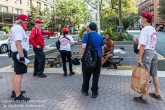 Curtis Sliwa, founder of the Guardian Angels, and his crew speak to a group of  unsheltered men while patroling the Upper West Side in New York City on August 9, 2020.  The neighborhood has experienced an uptick in crime and drugs after hotels have been turned into homeless shelters. (Photo by Gabriele Holtermann)