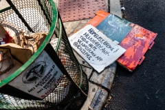 A sign belonging to a homeless person lays next to a trash can on the Upper West Side in New York City on August 9, 2020. (Photo by Gabriele Holtermann)