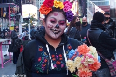 Day of The Dead and Black Lives Matters participants march through Times Square.