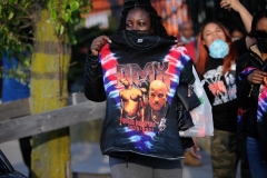 A fan of DMX holds a shirt during a funeral procession at Christian Cultural Center in the borough of Brooklyn, New York.