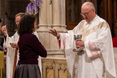 Cardinal Timothy Dolan blesses a High School senior at mass with nearly  2,000 graduating Catholic High School seniors at St. Patrick’s Cathedral in New York, New York, on May 18, 2022. (Photo by Gabriele Holtermann/Sipa USA)