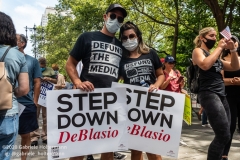 A couple attends the "Don't Give Up the Ship" rally outside City Hall Park in New York City on August 22, 2020. The rally, led by Staten Island based artist Scott LoBaido, called out the Mayor's failure addressing the recent spike in gun violence and increase in homeless encampments. (Photo by Gabriele Holtermann)