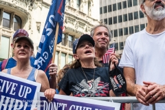 A woman waves the American flag at  the "Don't Give Up the Ship" rally outside City Hall Park in New York City on August 22, 2020. The rally, led by Staten Island based artist Scott LoBaido, called out the Mayor's failure addressing the recent spike in gun violence and increase in homeless encampments. (Photo by Gabriele Holtermann)
