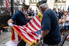 Two war veterans fold the American flag at the "Don't Give Up the Ship" rally outside City Hall Park in New York City on August 22, 2020. The rally, led by Staten Island based artist Scott LoBaido, called out the Mayor's failure addressing the recent spike in gun violence and increase in homeless encampments. (Photo by Gabriele Holtermann)