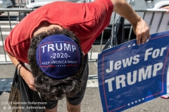 A Jewish man wears a Trump yamaka and holds a sign "Jew For Trump" at  the "Don't Give Up the Ship" rally outside City Hall Park in New York City on August 22, 2020. The rally, led by Staten Island based artist Scott LoBaido, called out the Mayor's failure addressing the recent spike in gun violence and increase in homeless encampments. (Photo by Gabriele Holtermann)