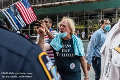 NYPD officers diffuse a tense situation between Black Lives Matter protestors and Blue Lives Matter protestors after  the "Don't Give Up the Ship" rally outside City Hall Park in New York City on August 22, 2020. The rally, led by Staten Island based artist Scott LoBaido, called out the Mayor's failure addressing the recent spike in gun violence and increase in homeless encampments. (Photo by Gabriele Holtermann)