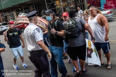 NYPD officers diffuse a tense situation between Black Lives Matter protestors and Blue Lives Matter protestors after  the "Don't Give Up the Ship" rally outside City Hall Park in New York City on August 22, 2020. The rally, led by Staten Island based artist Scott LoBaido, called out the Mayor's failure addressing the recent spike in gun violence and increase in homeless encampments. (Photo by Gabriele Holtermann)