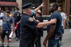 NYPD officers diffuse a tense situation between Black Lives Matter protestors and Blue Lives Matter protestors after  the "Don't Give Up the Ship" rally outside City Hall Park in New York City on August 22, 2020. The rally, led by Staten Island based artist Scott LoBaido, called out the Mayor's failure addressing the recent spike in gun violence and increase in homeless encampments. (Photo by Gabriele Holtermann)