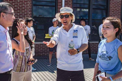 Chairman Henry Wan of the Hong Kong Dragon Festival NY speaks to guests after a 2 year hiatus. The HKDBF NY commenced at the Meadow Lake in Flushing Meadows Corona Park, Queens. 
The two day event celebrates the 30th anniversary of the event as well as The Year of the Tiger. A large program filled with events such as  with dragon dance, multi-cultural performers, traditional arts and crafts as well as a selection of food trucks.