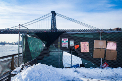 East River Park Protest & Details		

Protesters gathered in East River Park to prevent contracted construction workers from cutting down trees for headway on the ESCR - East Side Coastal Resiliency project, an effort of the city to build a levee that will provide flood control.
According to public plans, a 1.2 mile wall with razed park over an 8 foot fill will line the East River, requiring the expunging of an estimated 1000 trees along the river bank. Last year in December the Cherry and London Plane trees of the south section of the park were, cut and further work has resumed on northern half this January. 
Locals in the city, retaliate against the project due to what they claim to be, a thwarted joint effort for a viable solution for flooding and keeping the park in tact that is beloved and iconic component of not only the neighborhood but NYC. 
For more information: 
www.eastriverparkaction.org
January 31, 2021
East River Park, East Village, NYC 
(C) Bianca Otero
