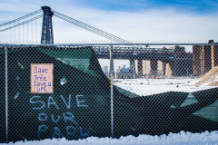 East River Park Protest & Details		

Protesters gathered in East River Park to prevent contracted construction workers from cutting down trees for headway on the ESCR - East Side Coastal Resiliency project, an effort of the city to build a levee that will provide flood control.
According to public plans, a 1.2 mile wall with razed park over an 8 foot fill will line the East River, requiring the expunging of an estimated 1000 trees along the river bank. Last year in December the Cherry and London Plane trees of the south section of the park were, cut and further work has resumed on northern half this January. 
Locals in the city, retaliate against the project due to what they claim to be, a thwarted joint effort for a viable solution for flooding and keeping the park in tact that is beloved and iconic component of not only the neighborhood but NYC. 
For more information: 
www.eastriverparkaction.org
January 31, 2021
East River Park, East Village, NYC 
(C) Bianca Otero
