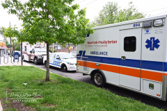 EMT Shot
West Brighton, Staten Island, NY
Photograph by Mary DiBiase Blaich

EMT Richard McMahon was released from Richmond University Medical Center on Thursday, May 19, 2022 after a harrowing incident the evening before.
On Wednesday, May 18, 2022, an EMT crew from Richmond University Medical Center responded around 7:30 PM to a call of an EDP at “The Funkey Monkey Lounge”, located at 1205 Forest Avenue.  They removed the individual and began a transport to Richmond University Medical Center (RUMC).  A mile into their transport, the patient, Thomas McCauley, 37 yrs old, pulled a gun on the EMT, Richard McMahon, and  shot him.  The ambulance driver pulled over on the 600 block of Forest Avenue, at Bement Avenue.  The patient then bolted out of the ambulance, attempting to escape.  He was captured at the location by two passers by,  a retired NYPD Detective, Marty Grahm and a DSNY Lt Joseph Perrone, who was off duty with his family.  
Both Grahm and Perrone came to RUMC as EMT McMahon was released to cheering EMT’s from all over the region.
