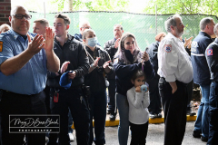 EMT Shot
West Brighton, Staten Island, NY
Photograph by Mary DiBiase Blaich

EMT Richard McMahon was released from Richmond University Medical Center on Thursday, May 19, 2022 after a harrowing incident the evening before.
On Wednesday, May 18, 2022, an EMT crew from Richmond University Medical Center responded around 7:30 PM to a call of an EDP at “The Funkey Monkey Lounge”, located at 1205 Forest Avenue.  They removed the individual and began a transport to Richmond University Medical Center (RUMC).  A mile into their transport, the patient, Thomas McCauley, 37 yrs old, pulled a gun on the EMT, Richard McMahon, and  shot him.  The ambulance driver pulled over on the 600 block of Forest Avenue, at Bement Avenue.  The patient then bolted out of the ambulance, attempting to escape.  He was captured at the location by two passers by,  a retired NYPD Detective, Marty Grahm and a DSNY Lt Joseph Perrone, who was off duty with his family.  
Both Grahm and Perrone came to RUMC as EMT McMahon was released to cheering EMT’s from all over the region.