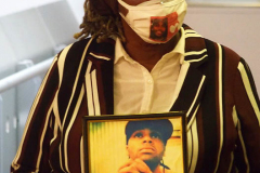 A  Mother holds a photo of her son who was killed by a gun at a roundtable on gun violence with NYC Mayor Eric Adams at Our Children’s Foundation in Harlem, New York City on 02 Jan 2022