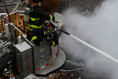 Firefighters operate at a house explison at 50 Bay 35 Street.