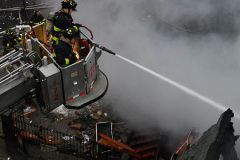 Firefighters operate at a house explison at 50 Bay 35 Street.