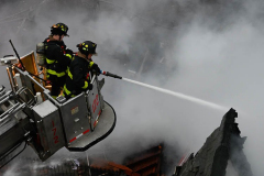 Firefighters operate at a house explison at 50 Bay 35 Street.