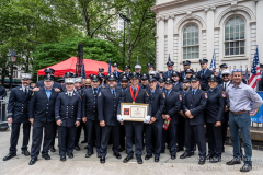FF Brian Murphy (middle) and members of Ladder Company 29 attend the FDNY Medal Day 2022 at City Hall in New York, New York, on June 1, 2022. (Photo by Gabriele Holtermann/Sipa USA)