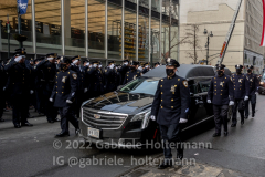 Thousands of police officers pay their respect as the hearse with the casket of fallen NYPD Officer Wilbert Mora makes its way down 5th Avenue in New York, New York, on Feb. 2, 2022. (Photo by Gabriele Holtermann/Sipa USA)
