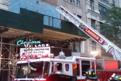 A fire broke out on the scaffolding of the iconic Cinema Village theater during the Wildlife Conservation Film Festival, on Saturday, October 16th in the West Village, NYC. 
The building which once housed a firehouse at the turn of the 20th century, had smoke bellowing from the top when a guest noticed.
FDNY found that possible cigarette butt thrown from above could be the possible culprit. Fortunately, no damage was done. (C) Bianca Otero, NYC, October 16, 2021.