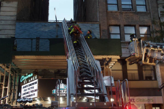 A fire broke out on the scaffolding of the iconic Cinema Village theater during the Wildlife Conservation Film Festival, on Saturday, October 16th in the West Village, NYC. 
The building which once housed a firehouse at the turn of the 20th century, had smoke bellowing from the top when a guest noticed.
FDNY found that possible cigarette butt thrown from above could be the possible culprit. Fortunately, no damage was done. (C) Bianca Otero, NYC, October 16, 2021.