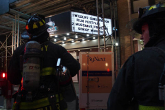 A fire broke out on the scaffolding of the iconic Cinema Village theater during the Wildlife Conservation Film Festival, on Saturday, October 16th in the West Village, NYC. 
The building which once housed a firehouse at the turn of the 20th century, had smoke bellowing from the top when a guest noticed.
FDNY found that possible cigarette butt thrown from above could be the possible culprit. Fortunately, no damage was done. (C) Bianca Otero, NYC, October 16, 2021.