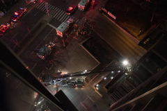 At about 11:15 on Friday March 4th, an acrid electrical  odor could be smelled in the air. Moments later  the FDNY arried, extended the ladder to the 4th floor and rescued two residents from their balcony. This bird's eye view from my 12th floor balcony shows the rig and EMTs caring for the residents on stretchers.